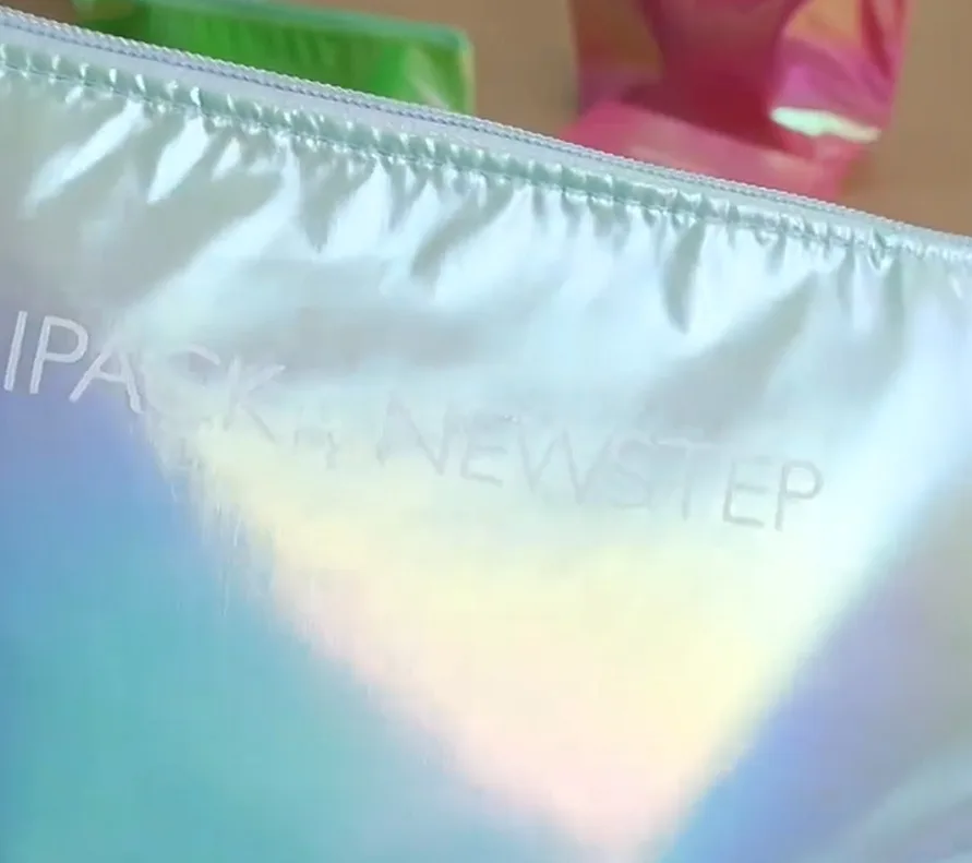 ridescent fabric, this material boasts a smooth texture and a gradient effect that reflects different colors under varying angles and lighting conditions, commonly used in the fashion industry.