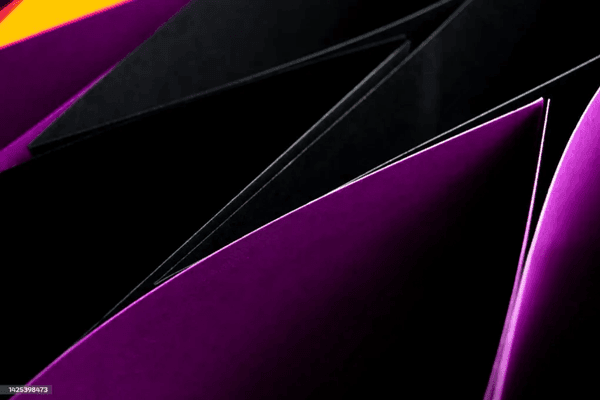 Abstract close-up of folded black and purple paper.