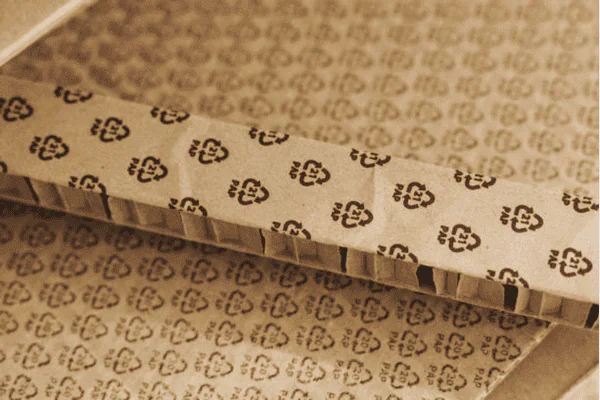 Close-up of honeycomb paper with hexagonal pattern, eco-friendly packaging design.