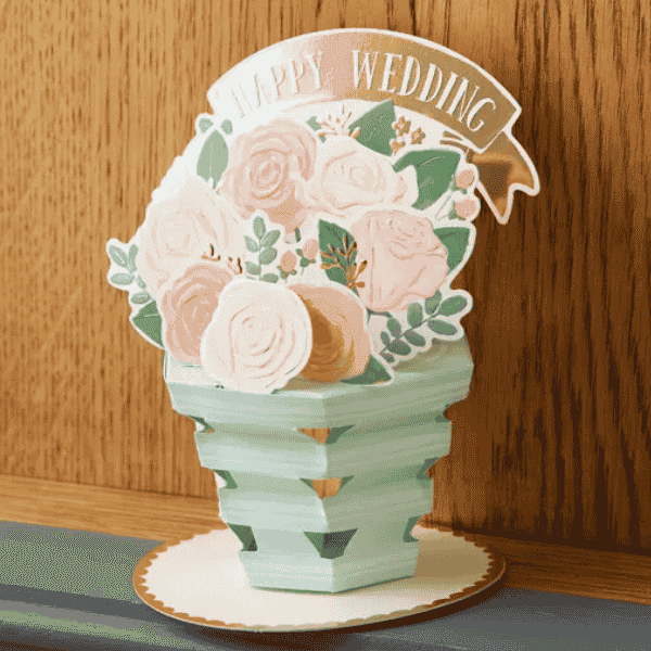 Elegant wedding pop-up card with floral bouquet.