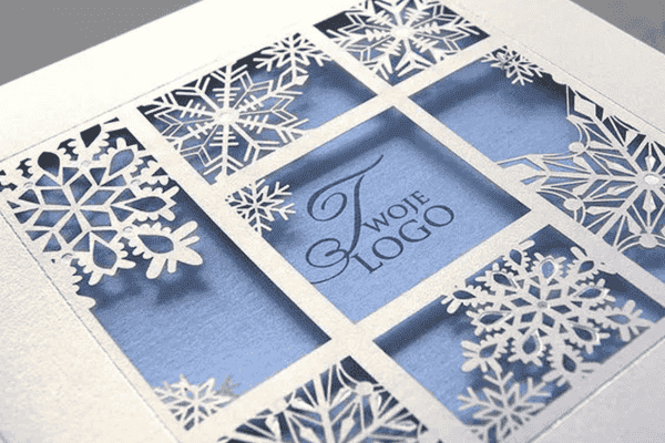 Intricate snowflake-themed laser-cut packaging design.