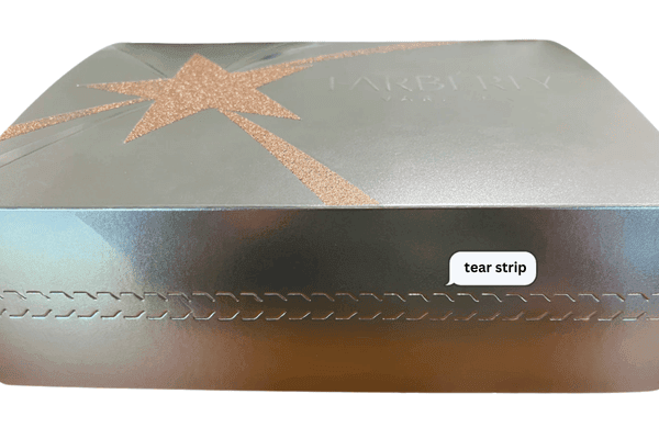 Luxury packaging with a tear strip feature.