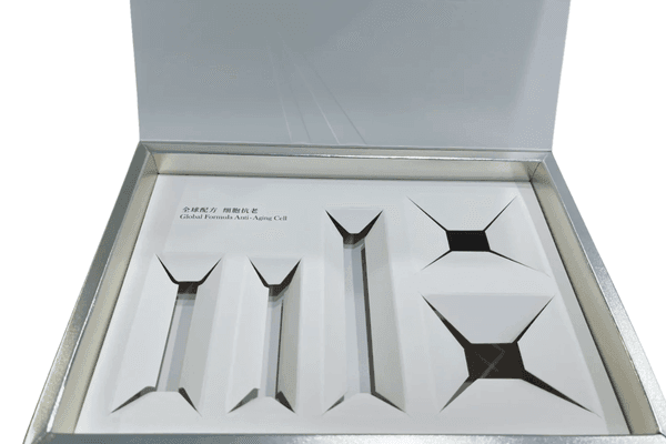 Luxury white packaging with custom insert slots.