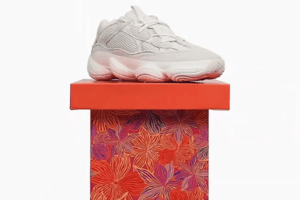 Stylish sneaker on a vibrant gift box.