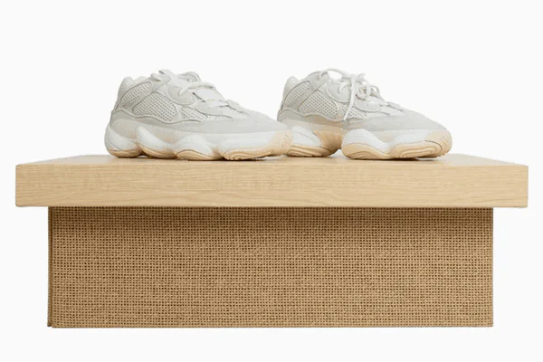 Textured cardboard shoe box with sneakers.