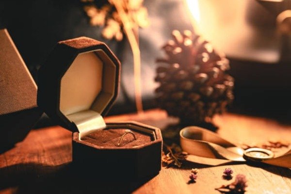 Use image: several rigid jewelry boxes with velvet inserts, foil logos, and necklace/ring layouts Custom luxury jewelry boxes with velvet inserts