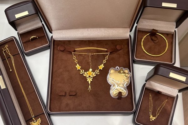 Luxury jewelry gift box opened with ring and necklace fitted in velvet insert