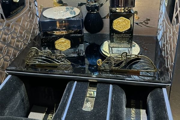 Alt: Retail cosmetic display box with cream Retail beauty counter display box with cream