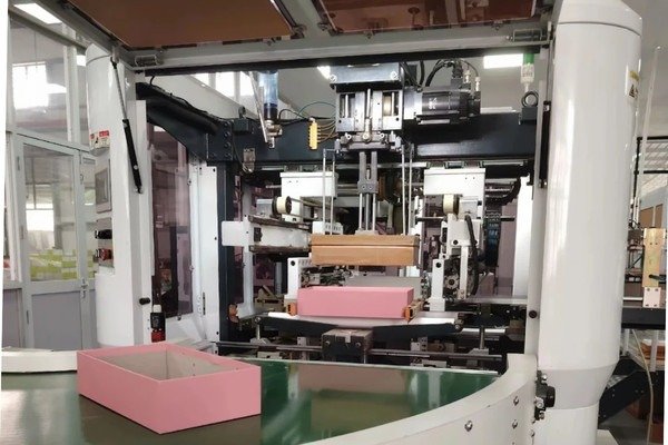 custom gift boxes with logo on a factory production table